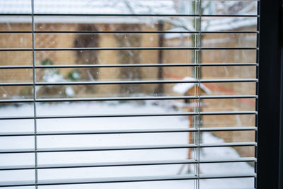 Full frame shot of window on metal grate