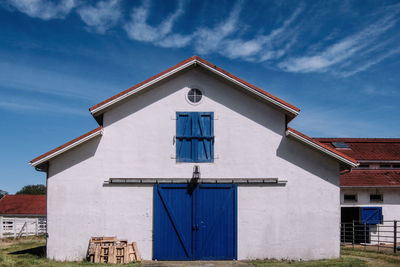 Low angle view of building against blue sky