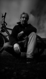 Portrait of a young man sitting outdoors