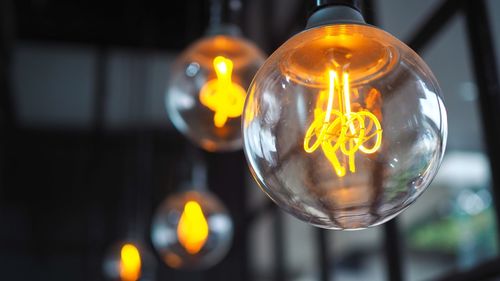 Close-up of illuminated light bulb