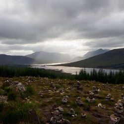 Scenic view of mountains against cloudy sky