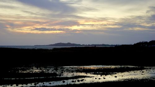 Scenic view of land during sunset