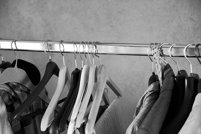 Close-up of clothes hanging on rack at store