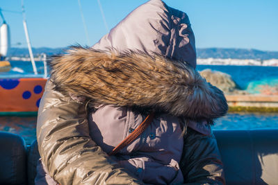 Midsection of man in sea during winter