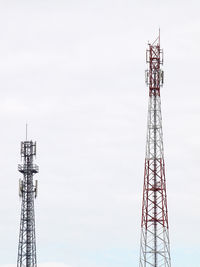 Low angle view of communications tower against sky