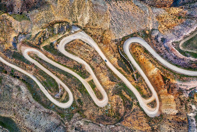 High angle view of road marking on rock