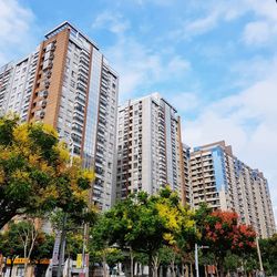 Low angle view of modern buildings against sky