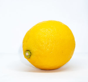 Close-up of lemon slice against white background