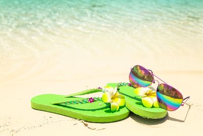 High angle view of toys on sand at beach