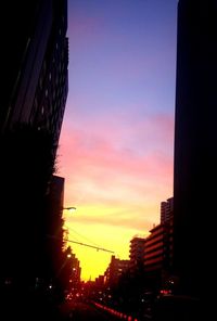 Traffic on road at sunset