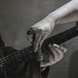 Midsection of men with guitar