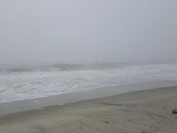 Scenic view of beach against clear sky