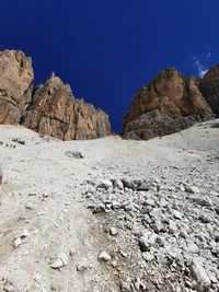 Scenic view of rocky mountains against clear blue sky