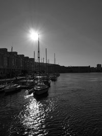 Boats moored at harbor