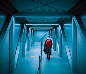 Female traveller boarding n the airport with backback