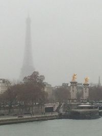 Buildings in city against sky