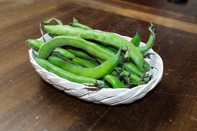 High angle view of vegetables in basket on table