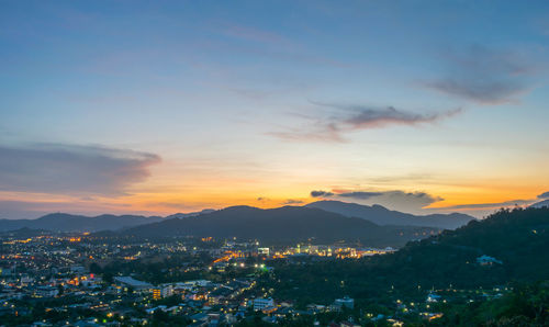 Aerial view of townscape against sky during sunset