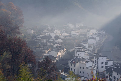 Aerial view of cityscape against sky