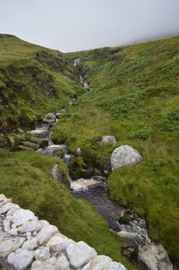 Scenic view of stream against sky