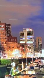 View of illuminated cityscape against sky