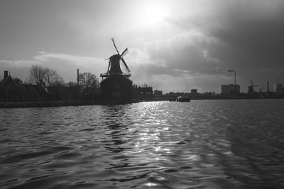 Traditional windmill against sky