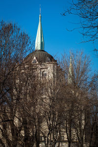 Low angle view of bare tree against clear sky