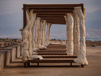 View of bench on beach