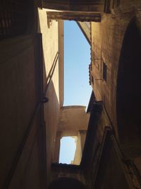 Low angle view of building seen through window