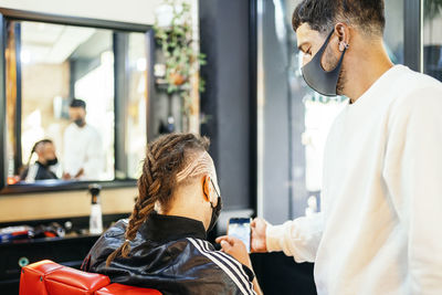 Midsection of man sitting in office