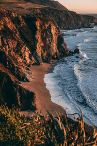 Scenic view of sea shore against sky