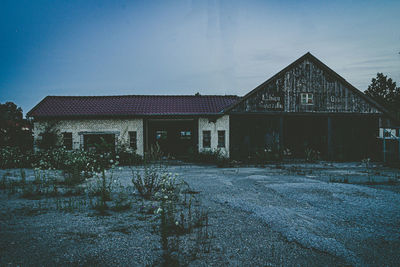 Exterior of old building against sky at dusk