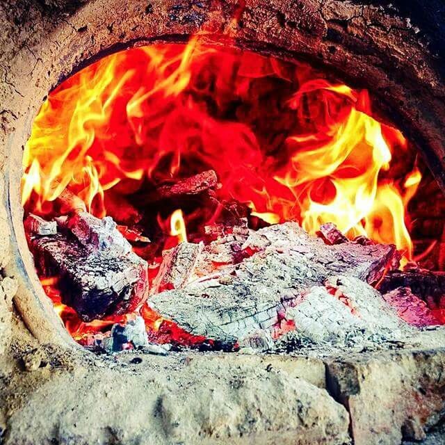 CLOSE-UP VIEW OF BONFIRE AT NIGHT