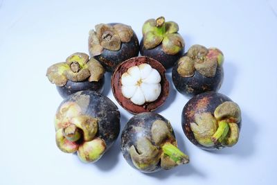 Close-up of fruits against white background