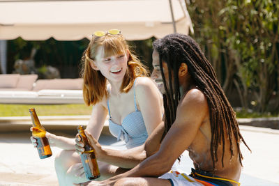 Young woman sitting outdoors