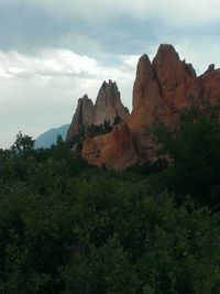 Scenic view of mountains against cloudy sky