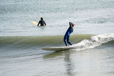 People standing in sea