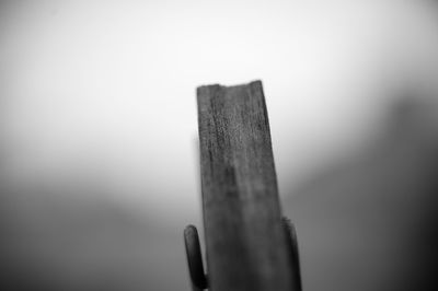 Close-up of wooden fence against clear sky