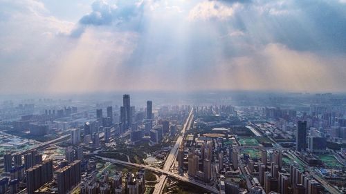 High angle view of modern buildings in city against sky