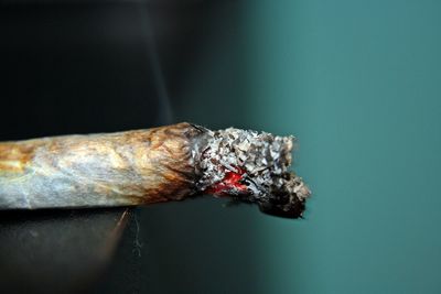 Close-up side view of a cigarette