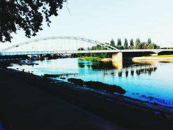 Bridge over river against clear sky