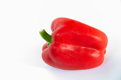 Close-up of red bell pepper against white background