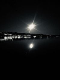 Scenic view of sea against clear sky at night