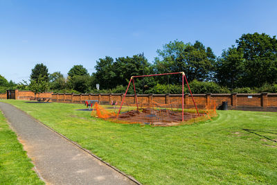 Empty playground against clear sky