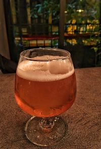 Close-up of beer glass on table