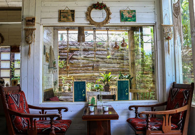 Empty chairs and tables in building