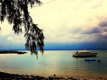 Scenic view of sea against cloudy sky