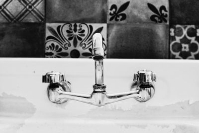 Close-up of faucet in bathroom