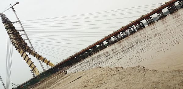 Low angle view of bridge against sky