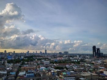 High angle view of buildings in city against sky